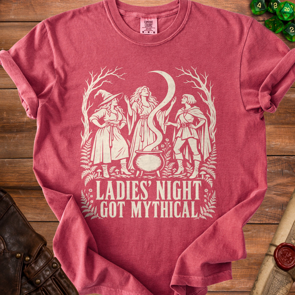 T-shirt with graphic of three women, a cauldron, and text "LADIES' NIGHT GOT MYTHICAL".