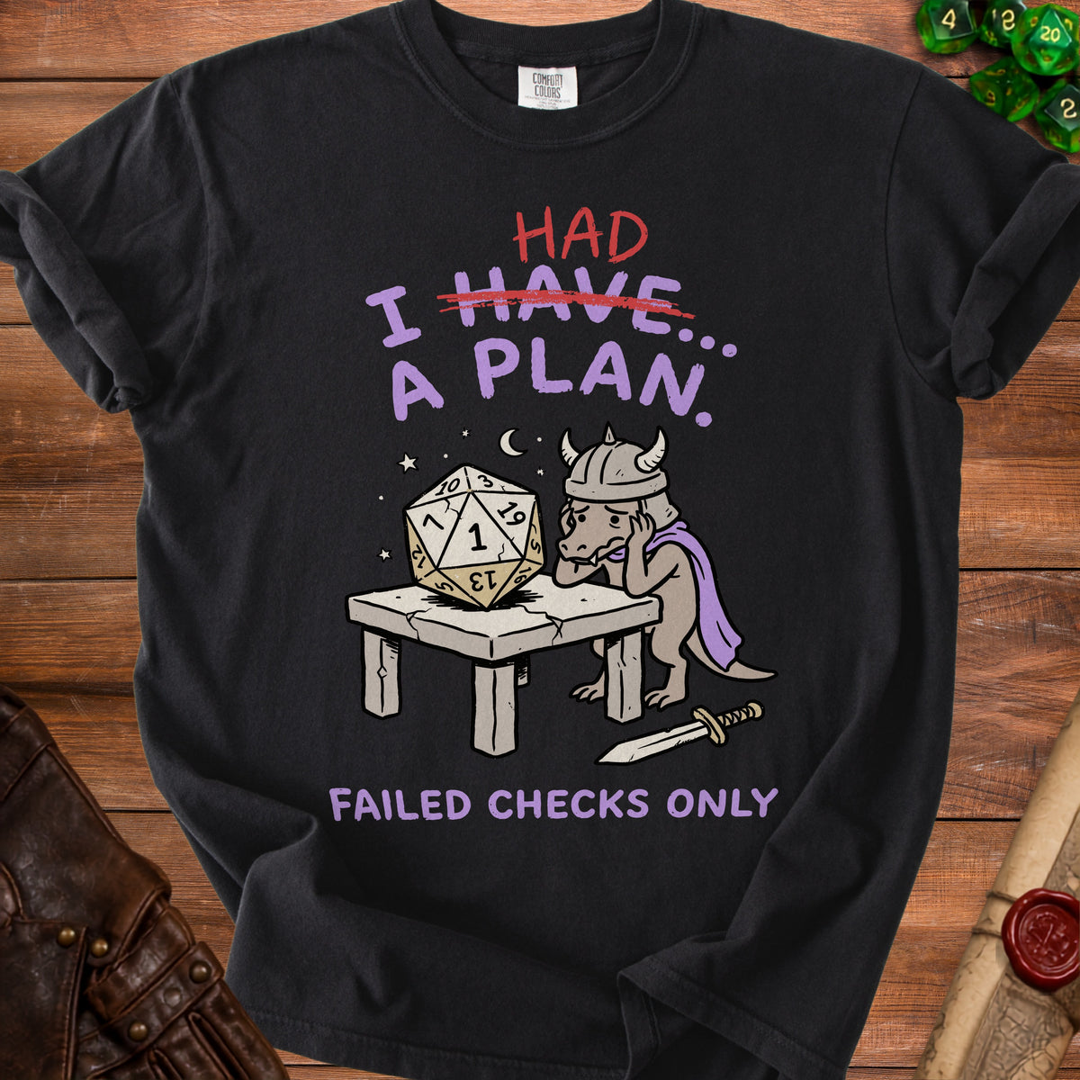 Black t-shirt with "HAD I HAVE... A PLAN." and dragon character with dice.