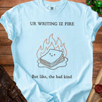 Light blue t-shirt with "UR WRITING IZ FIRE" and a burning stack of papers illustration.