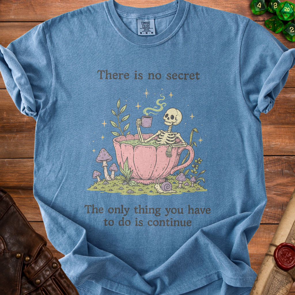 T-shirt with skeleton in teacup graphic and text "There is no secret The only thing you have to do is continue".