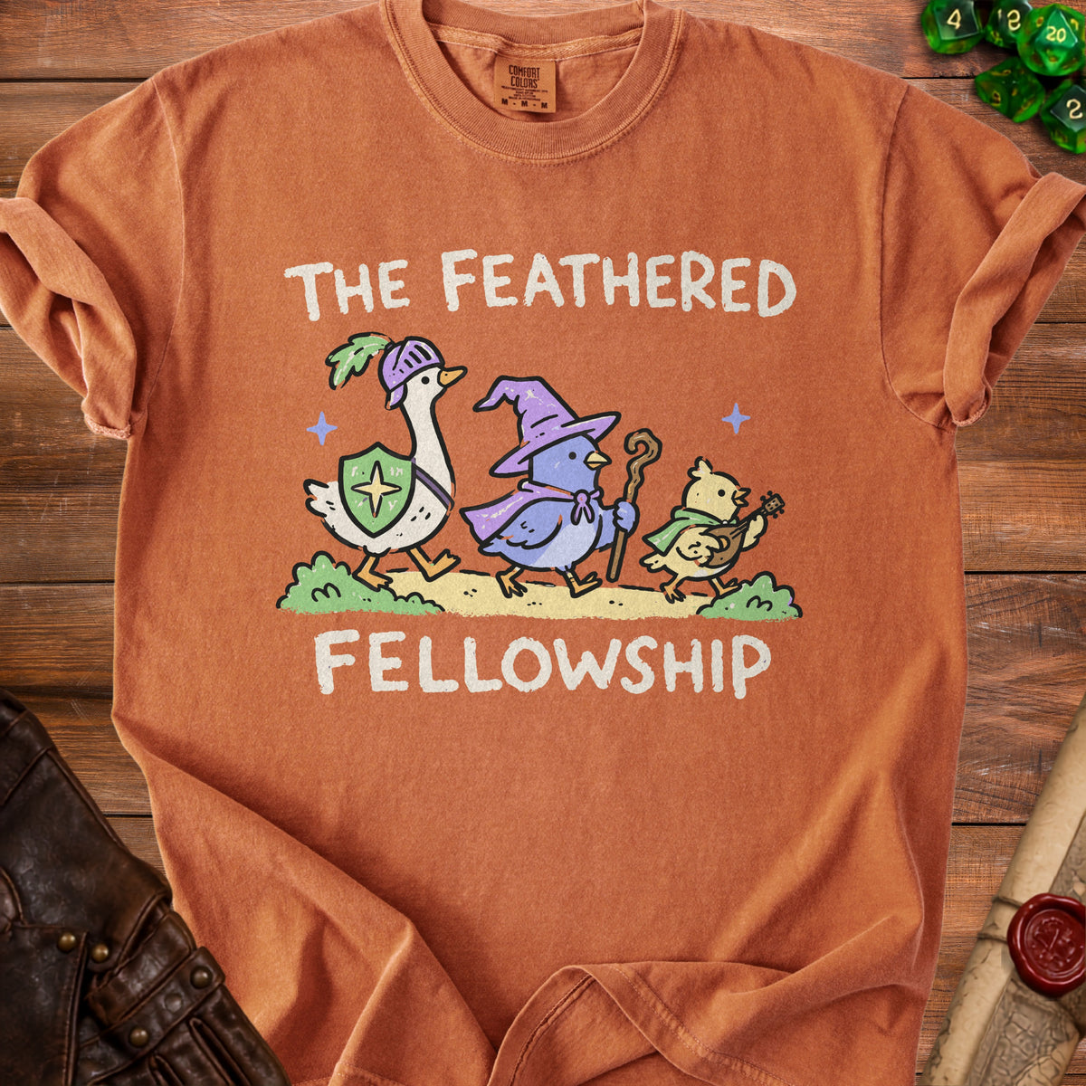 "The Feathered Fellowship" text on a comfort colors t-shirt with cartoon birds.