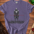 T-shirt with a drawing of a heavily armored knight and the text "JUST HERE TO SUFFER".