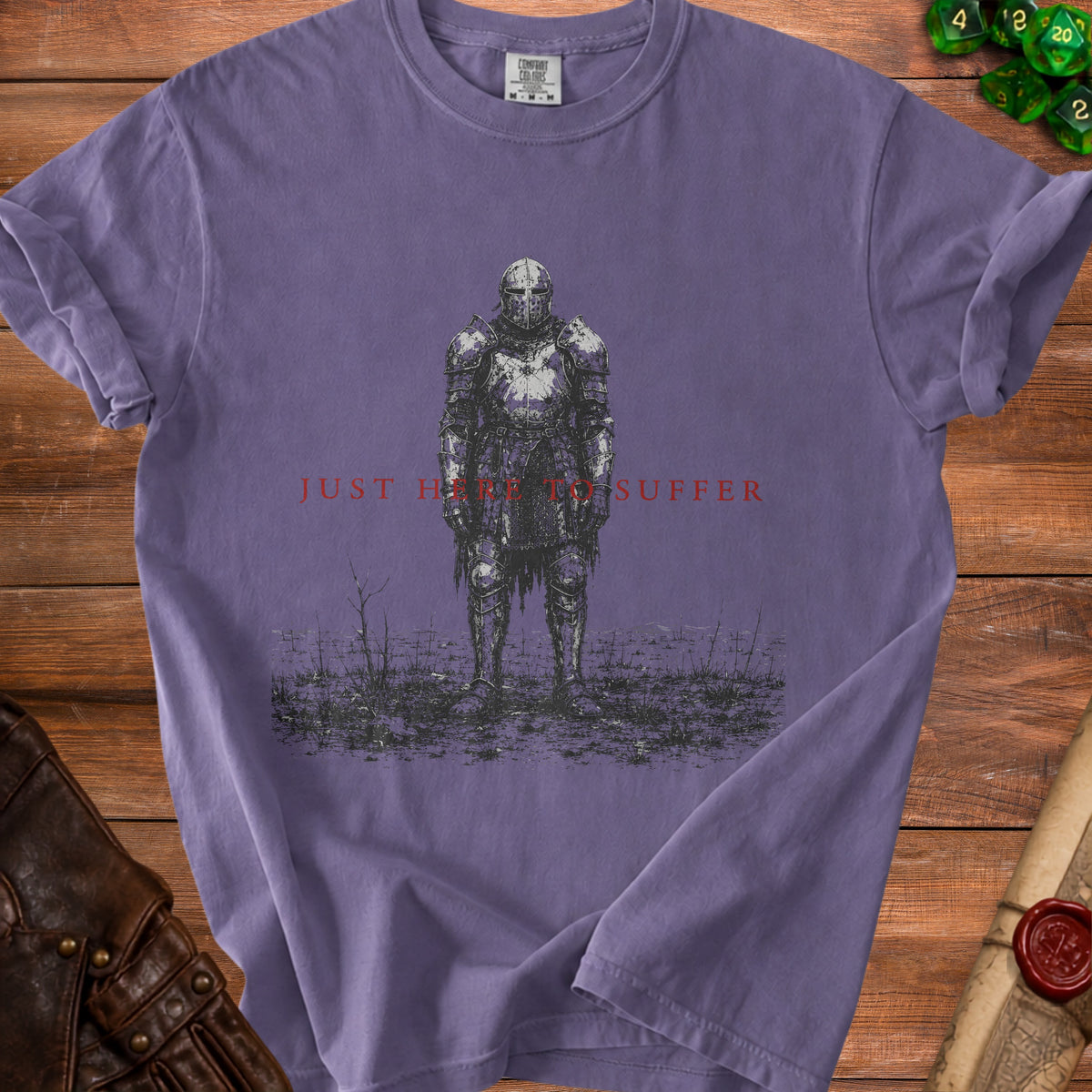 T-shirt with a drawing of a heavily armored knight and the text "JUST HERE TO SUFFER".