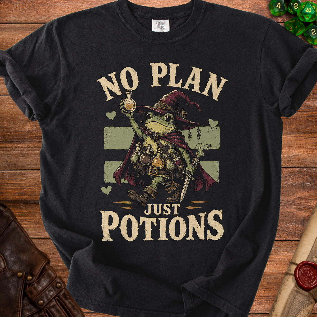 Black t-shirt with a wizard frog holding potions, text reads "NO PLAN JUST POTIONS".