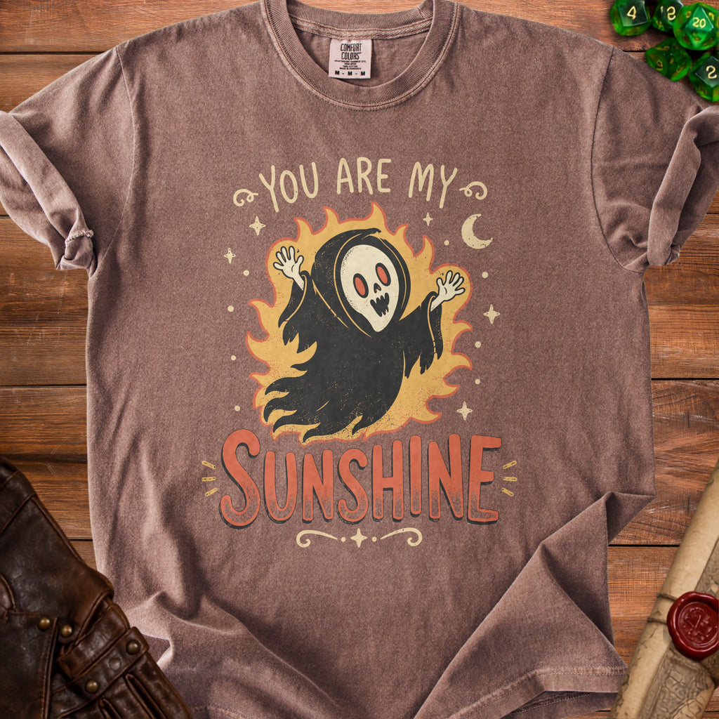 Brown t-shirt with ghost graphic saying "You are my sunshine".