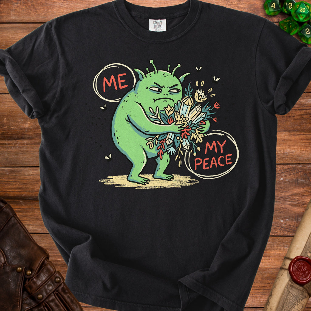 Black t-shirt with a grumpy green alien holding crystals and flowers, text "ME MY PEACE".