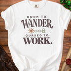 White t-shirt with text "BORN TO WANDER. CURSED TO WORK." and graphic.