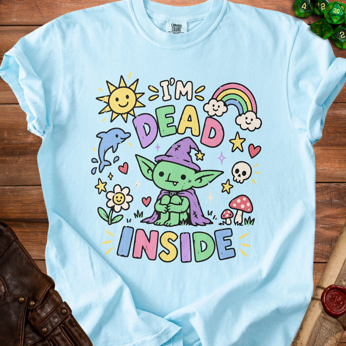 Light blue t-shirt with cartoon goblin saying "I'm Dead Inside" and cute illustrations.