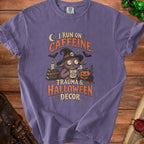 Purple t-shirt with text "I RUN ON CAFFEINE, TRAUMA & HALLOWEEN DECOR."