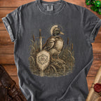 Duck knight in armor with sword and D20 shield in reeds with halo.