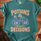 Teal t-shirt with "Potions & Poor Decisions" text and potion bottles graphic.