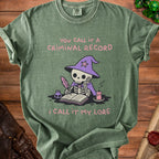 Green t-shirt with skeleton wearing wizard hat writing "You call it a criminal record, I call it my lore."