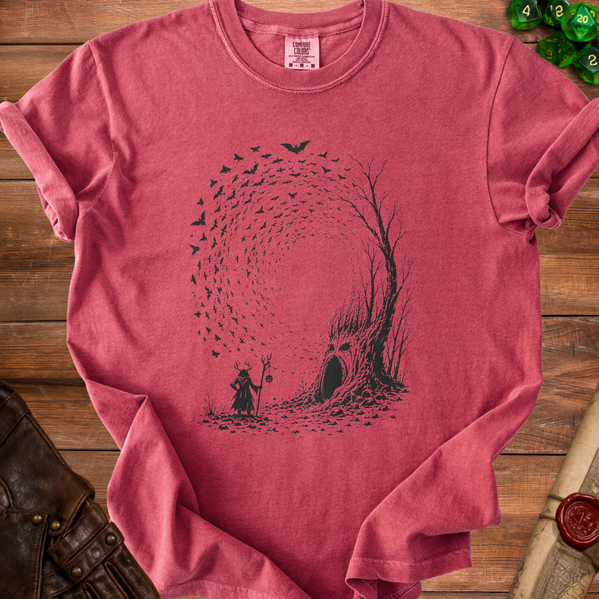 T-shirt with a dark print of a wizard, a spooky tree, and flying bats.