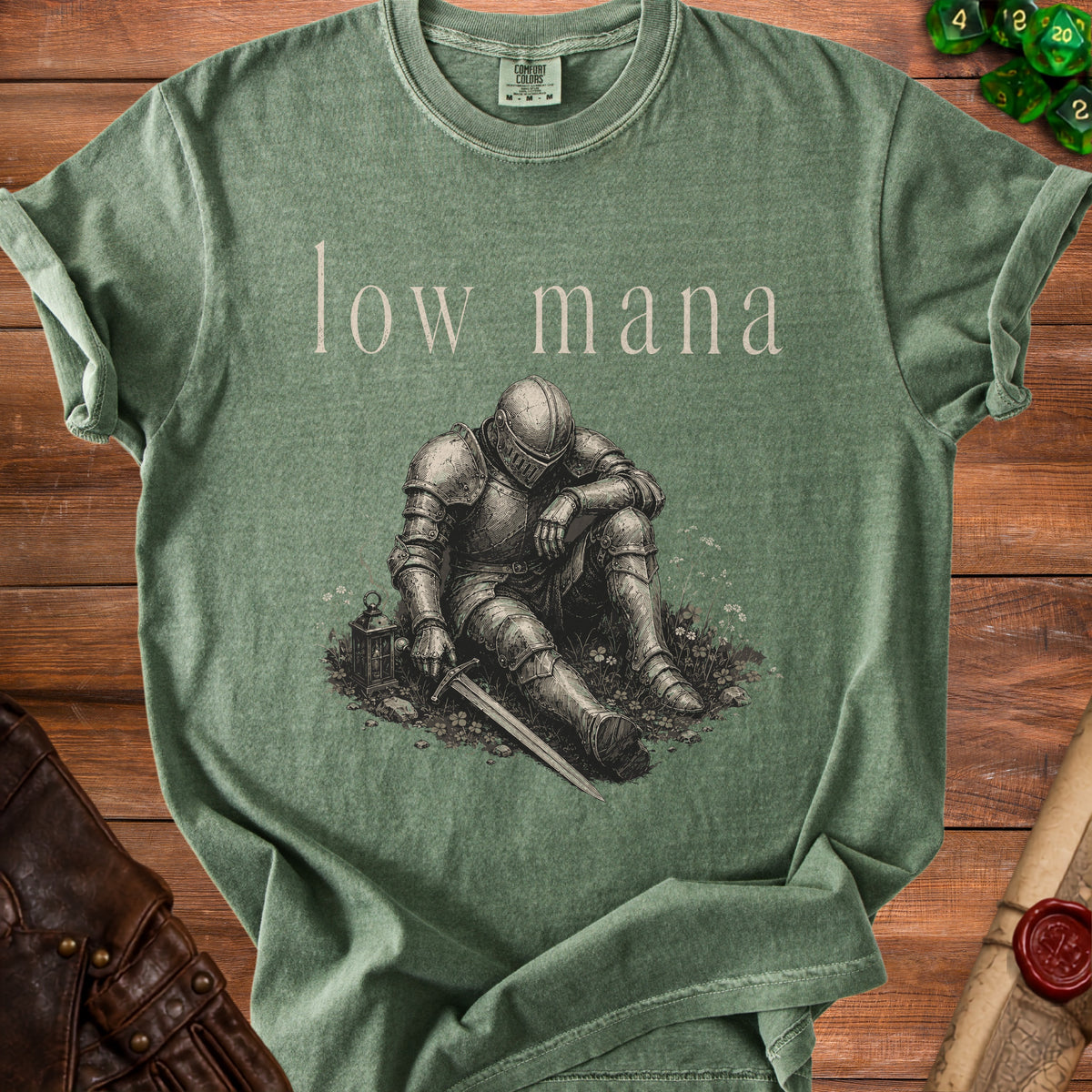 Green t-shirt with "low mana" text and distressed knight graphic.