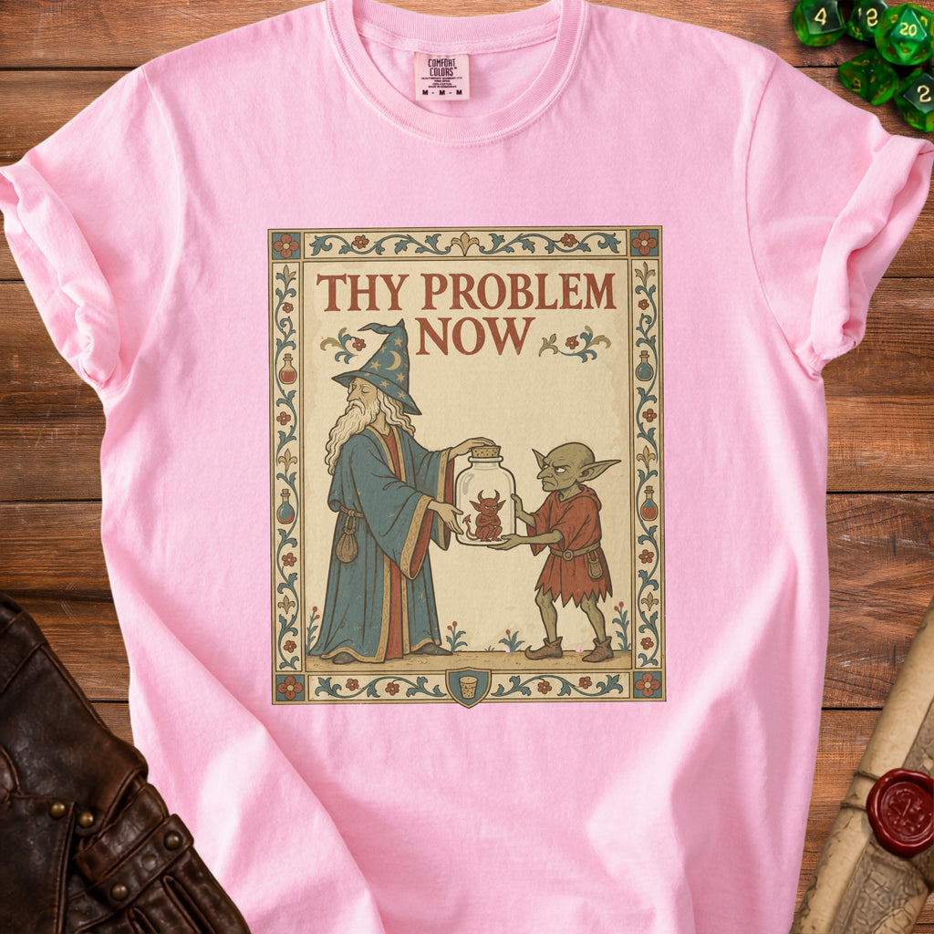 Pink t-shirt with "Thy Problem Now" text and wizard giving a jar to a goblin.