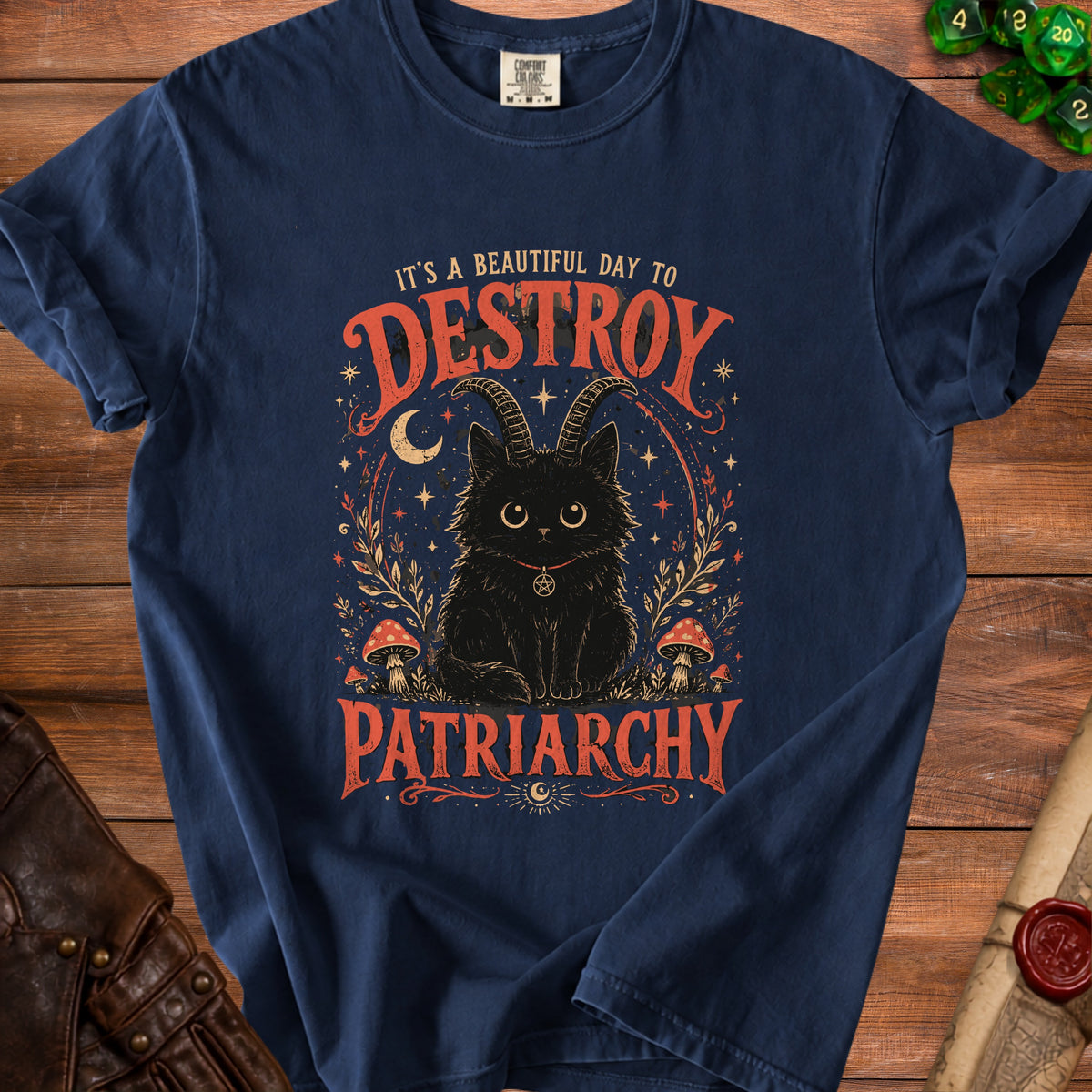 Navy t-shirt with black cat with horns, mushrooms, moon, and text "IT'S A BEAUTIFUL DAY TO DESTROY PATRIARCHY".