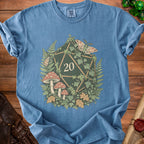 Blue t-shirt with a d20 dice surrounded by mushrooms, ferns, ivy, and moths.