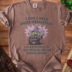 Brown t-shirt with graphic of goblin wizard and text "I DON'T NEED ANGER MANAGEMENT, I NEED PEOPLE TO STOP PISSING ME OFF MANAGEMENT."