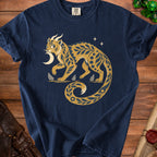 Navy t-shirt with a golden, stylized creature and crescent moon design.