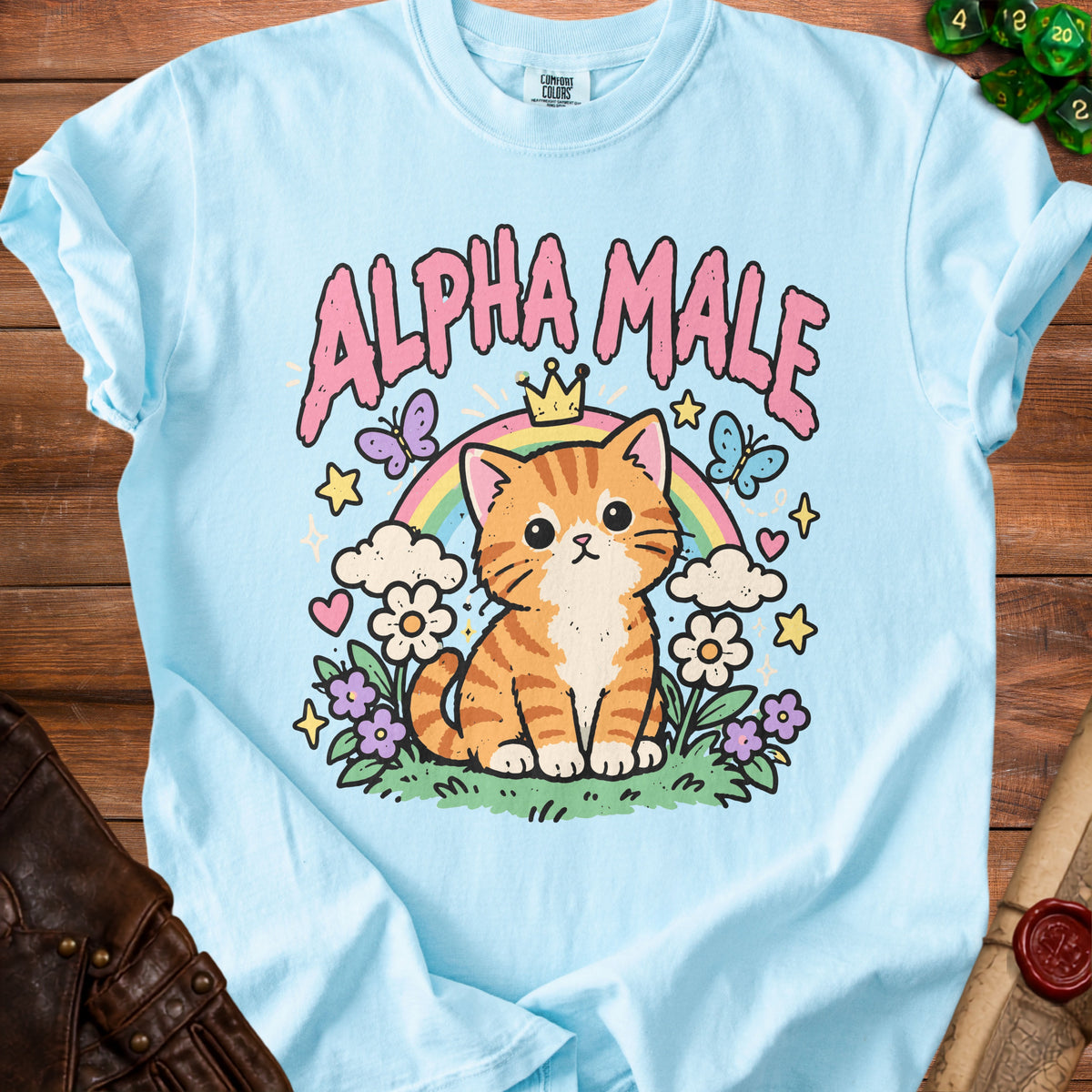 Light blue t-shirt with a cute cartoon tabby cat wearing a crown and rainbow.