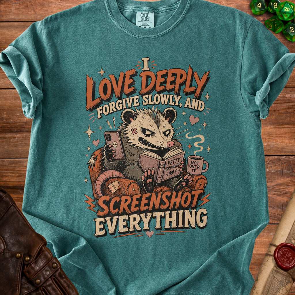 Opossum reading a book with phone and coffee, "I love deeply forgive slowly, and screenshot everything" text.