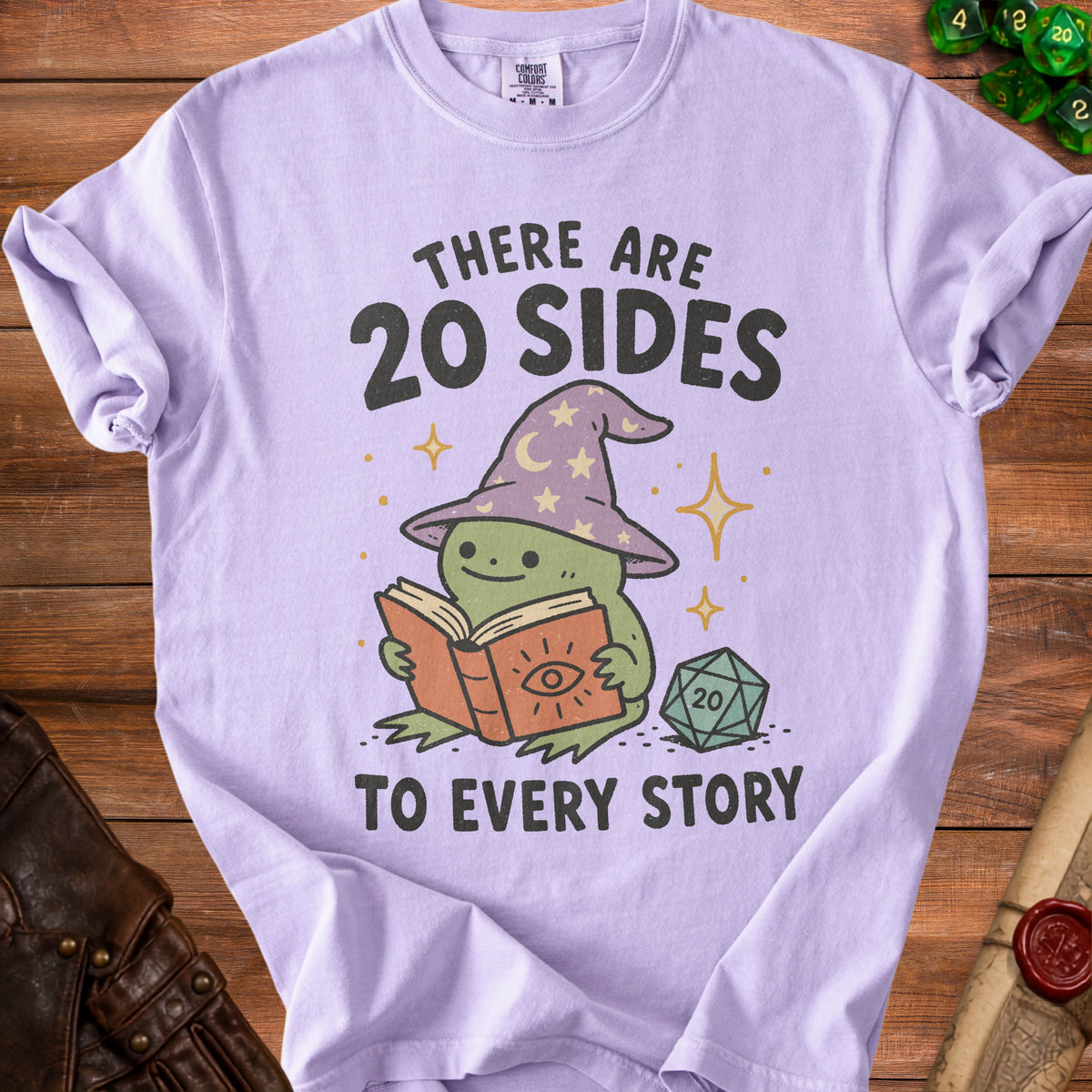 Purple t-shirt with frog reading book and text "There are 20 sides to every story".