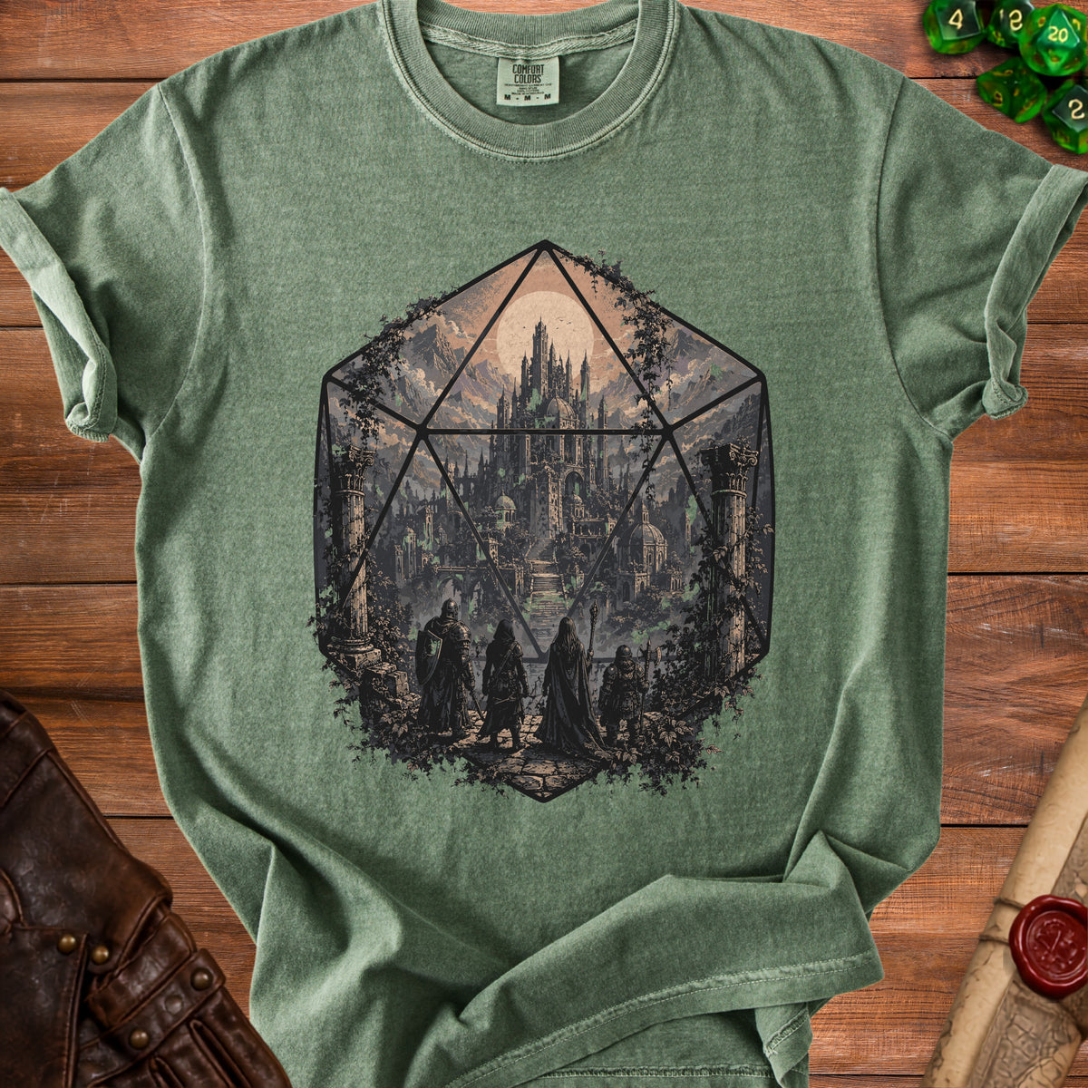 Green t-shirt with a d20 die graphic showing a fantasy castle and adventurers.