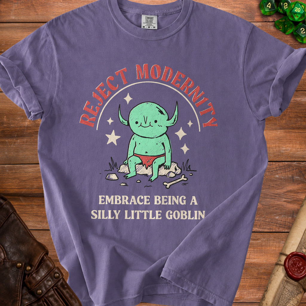Purple t-shirt with "Reject Modernity Embrace Being a Silly Little Goblin" text.