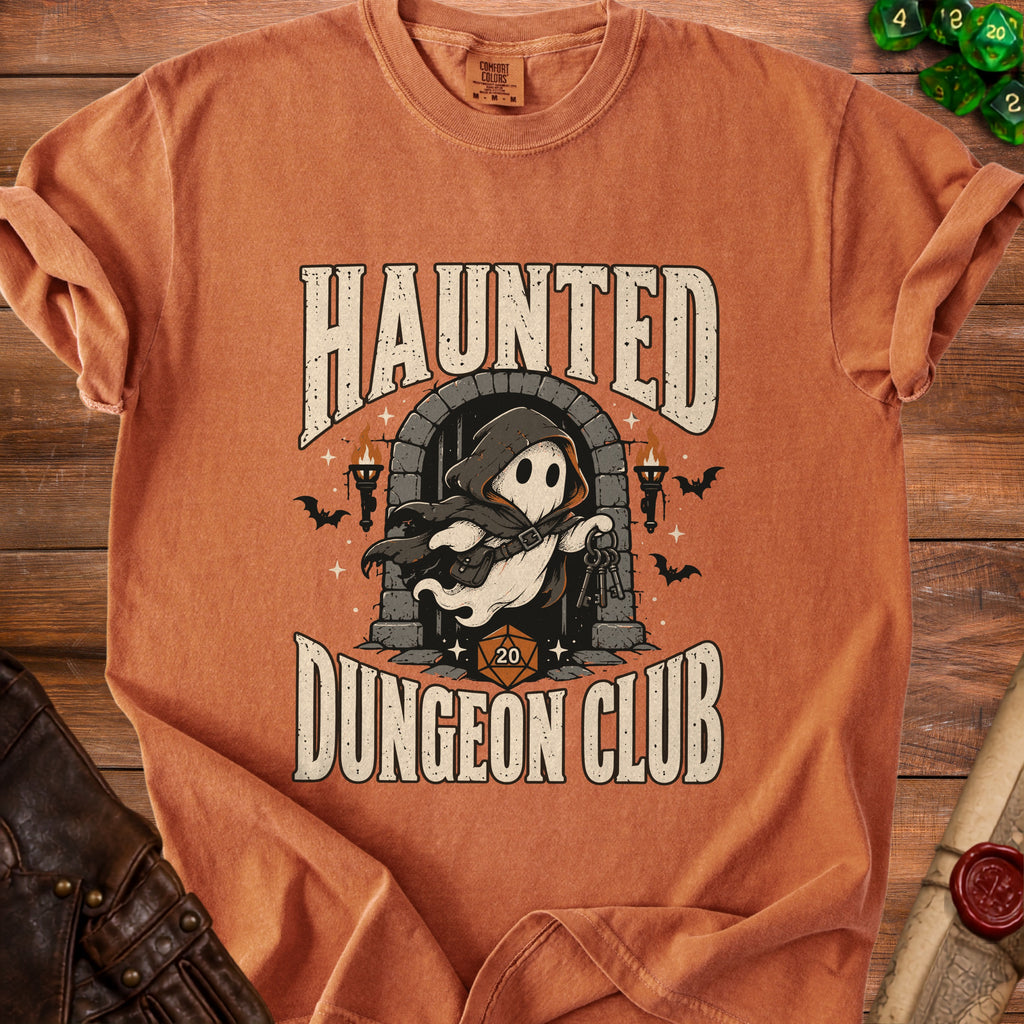 Orange t-shirt with "Haunted Dungeon Club" text and a ghost holding keys.