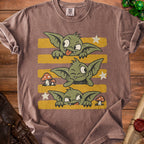 Brown t-shirt with three cartoon goblins and mushrooms on yellow stripes.