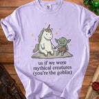 Lavender t-shirt with unicorn and goblin illustration and "us if we were mythical creatures" text.