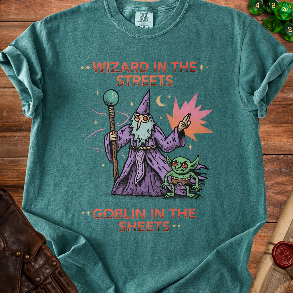Green t-shirt with illustration of a wizard and goblin, text "Wizard in the Streets Goblin in the Sheets".