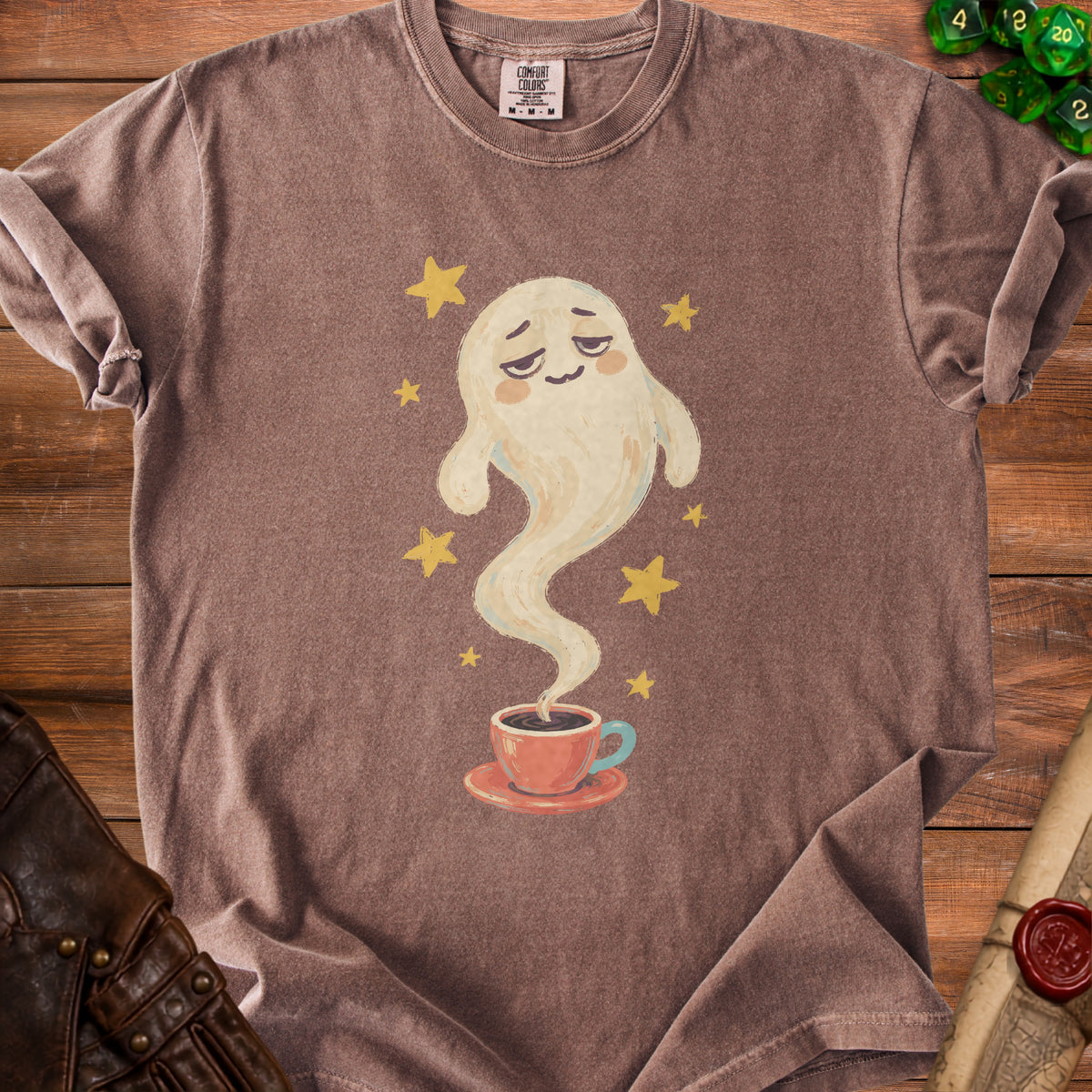 Brown t-shirt with a whimsical ghost emerging from a coffee cup, surrounded by stars.
