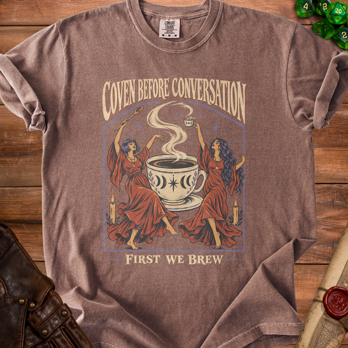 T-shirt with "Coven Before Conversation, First We Brew" text and graphic.