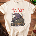 Cream t-shirt with a black cat wearing a witch hat and the text "what if I got weirder".