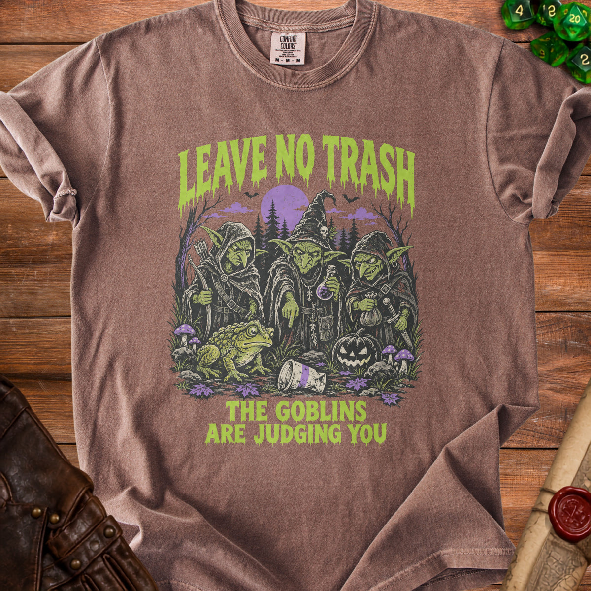Brown t-shirt with goblins, frog, and text "Leave No Trash The Goblins Are Judging You".