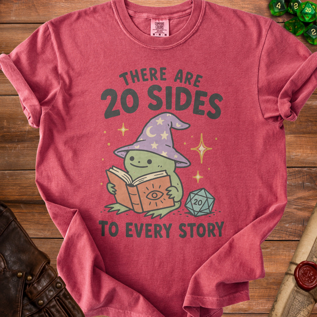 T-shirt with frog wizard reading book and text "There are 20 sides to every story".