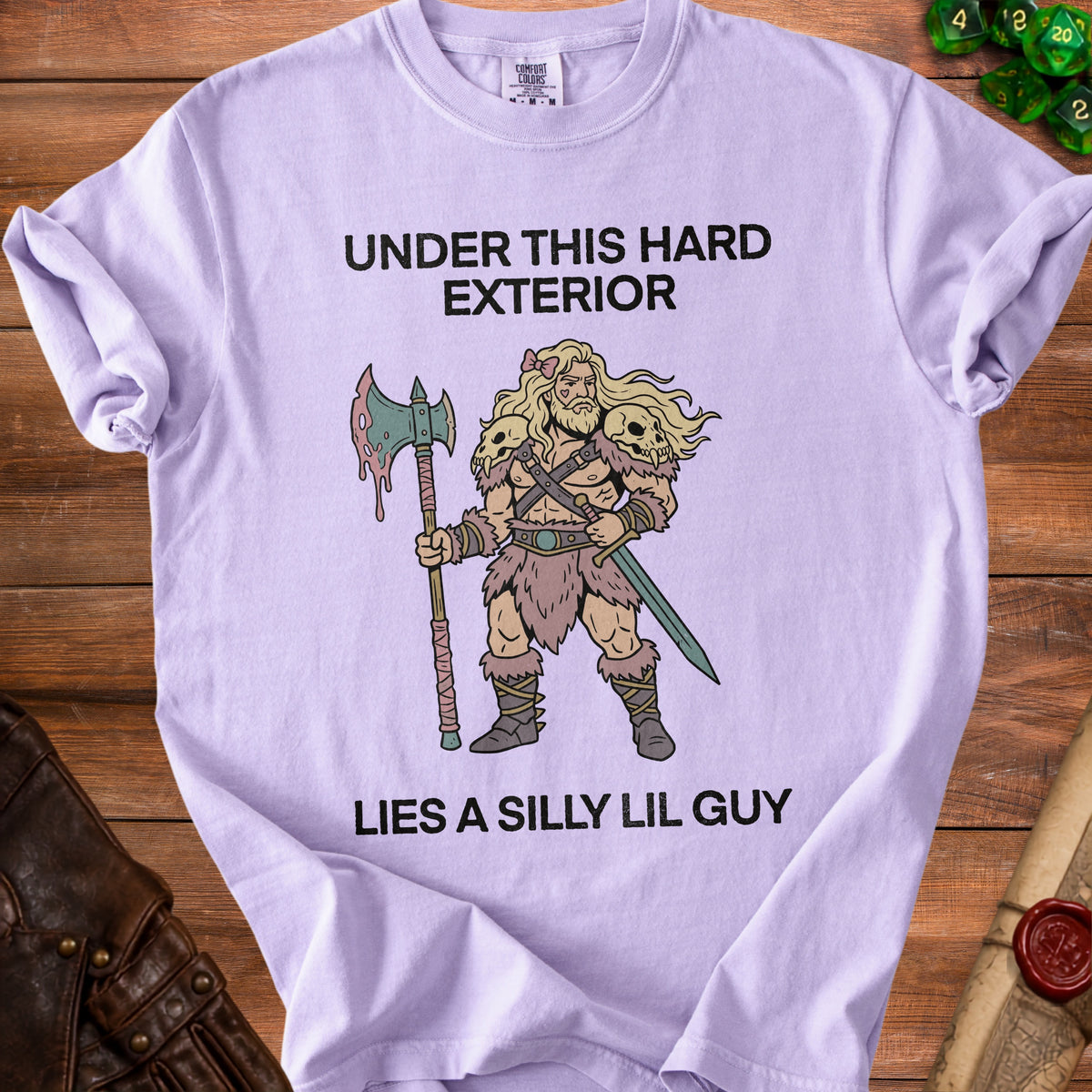 Purple t-shirt with text "UNDER THIS HARD EXTERIOR LIES A SILLY LIL GUY".
