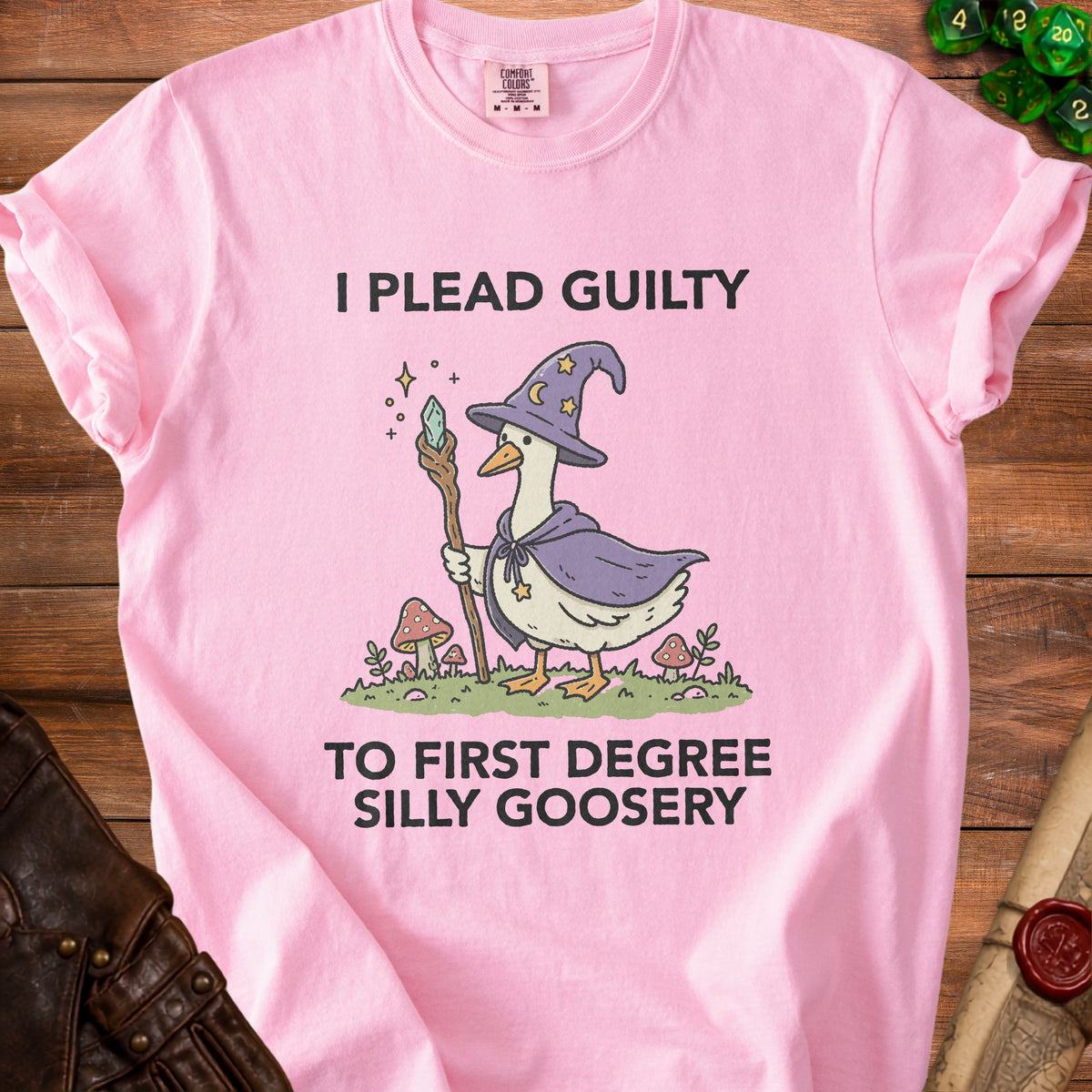 Pink t-shirt with illustration of a goose wizard and text "I PLEAD GUILTY TO FIRST DEGREE SILLY GOOSERY".