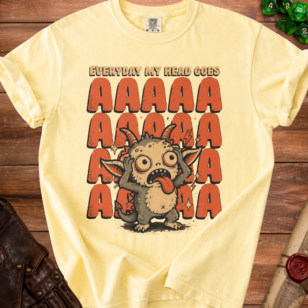 Yellow t-shirt with a cartoon monster and text reading "EVERYDAY MY HEAD GOES AAAAA".