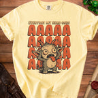 Yellow t-shirt with a cartoon monster and text reading "EVERYDAY MY HEAD GOES AAAAA".