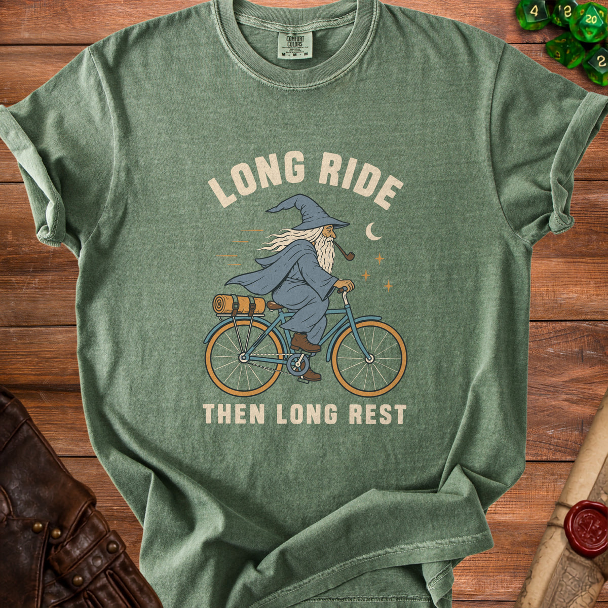 Green t-shirt with wizard on bicycle graphic and text "LONG RIDE THEN LONG REST".