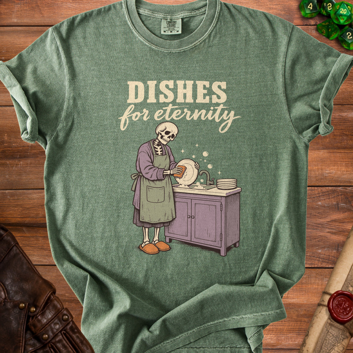 Green t-shirt with a skeleton washing dishes and text "DISHES for eternity".
