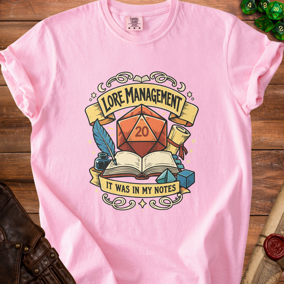 Pink t-shirt with "LORE MANAGEMENT" and "IT WAS IN MY NOTES" graphic.
