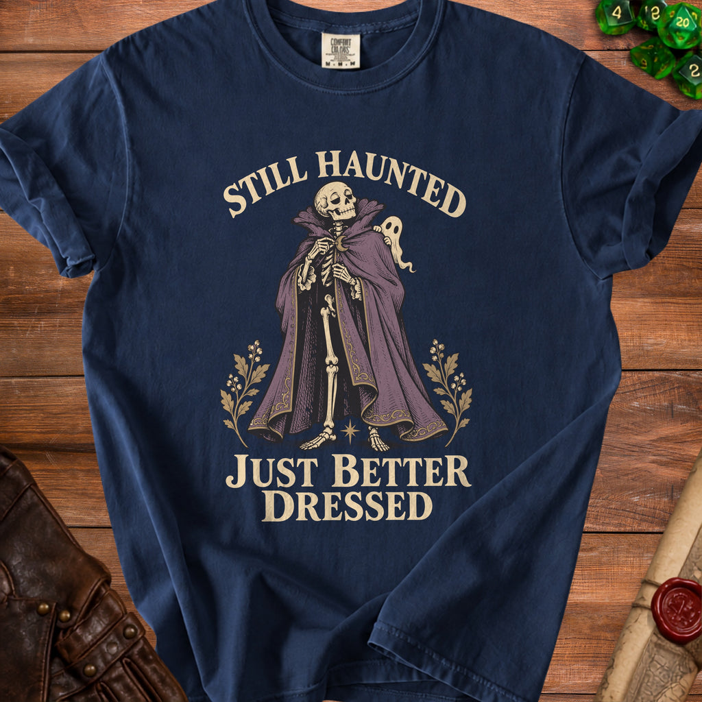 Navy t-shirt with skeleton, ghost, and text "Still Haunted Just Better Dressed".