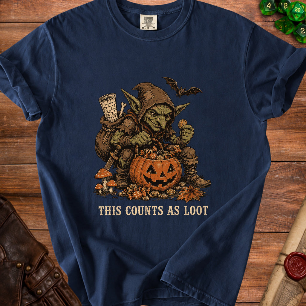 Goblin with pumpkin basket of candy, coins, and scroll. Text: "This Counts As Loot."