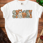 White t-shirt with "Spooky" text featuring a ghost, pumpkin, bats, and flowers.