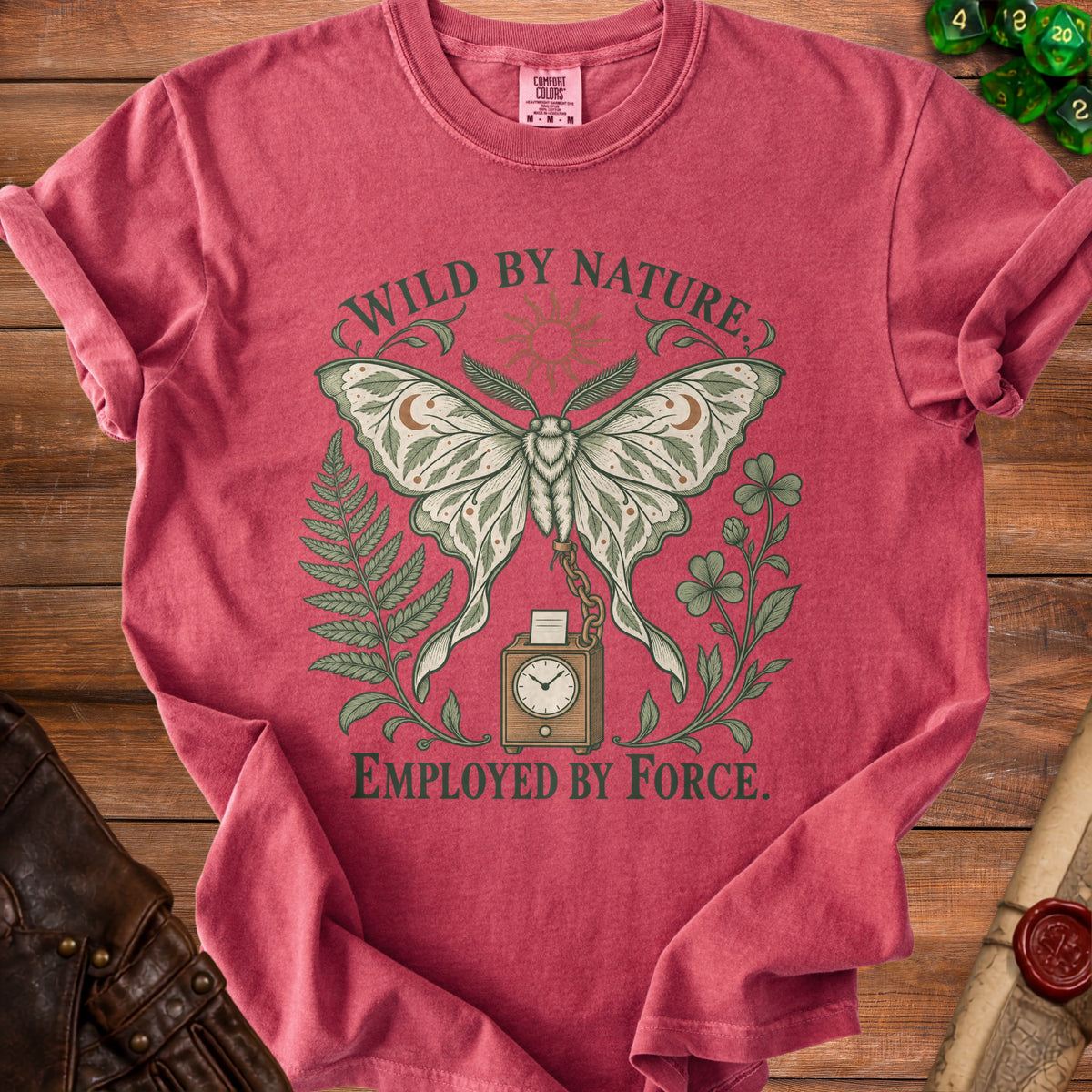 Red t-shirt with moth, plants, clock, and text "WILD BY NATURE. EMPLOYED BY FORCE."