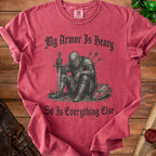 T-shirt with distressed knight graphic and text "My Armor Is Heavy So Is Everything Else".