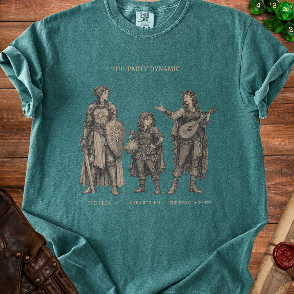 T-shirt with "The Party Dynamic" art featuring three fantasy characters and labels: The Plan, The Problem, The Encouragement.